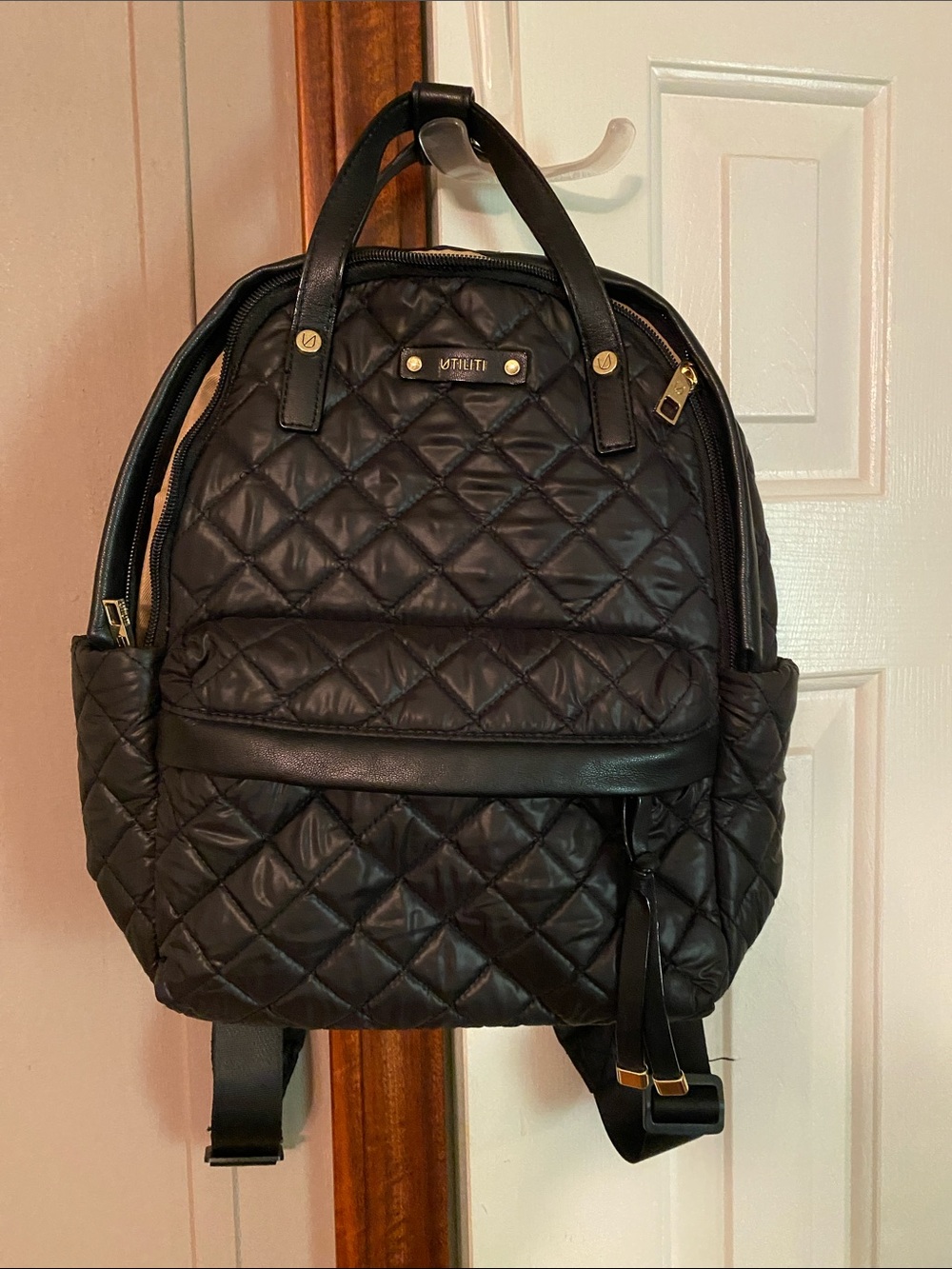 Quilted Black Backpack with Gold Accents